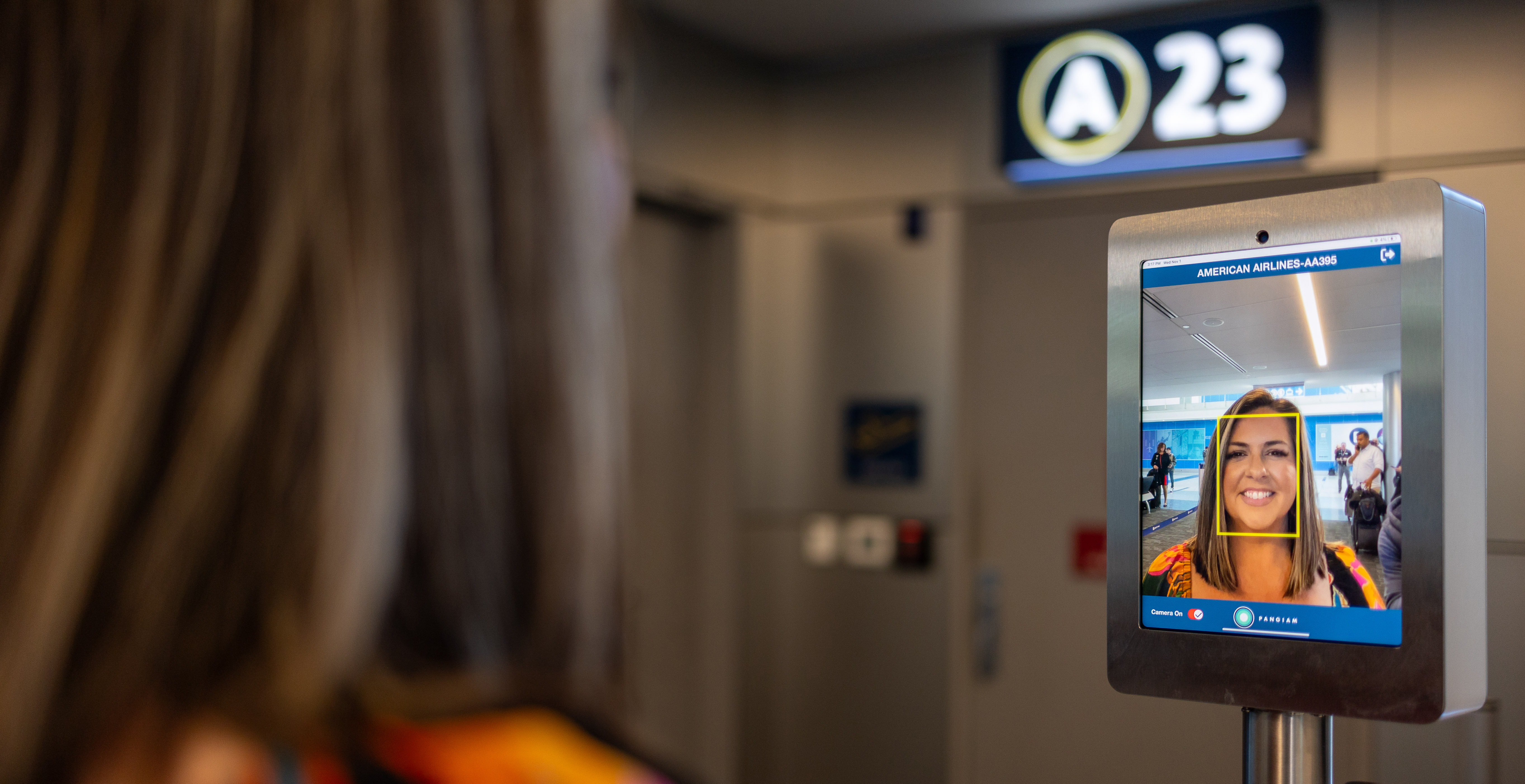 Passenger using Biometric Facial screen technology at gate A 23